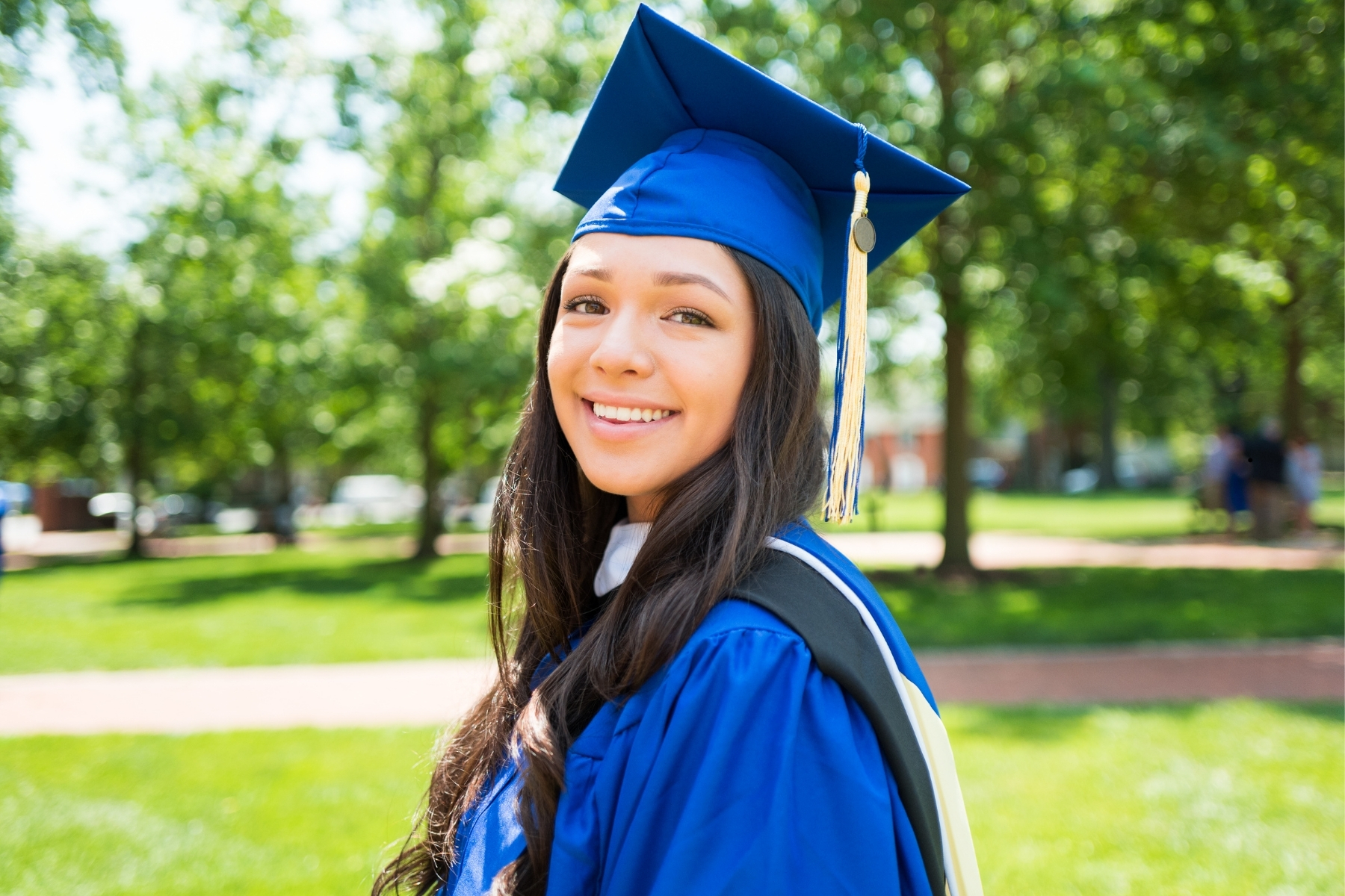 A college graduate in cap and gown - the long-term outcome of early career planning and intentional college experience